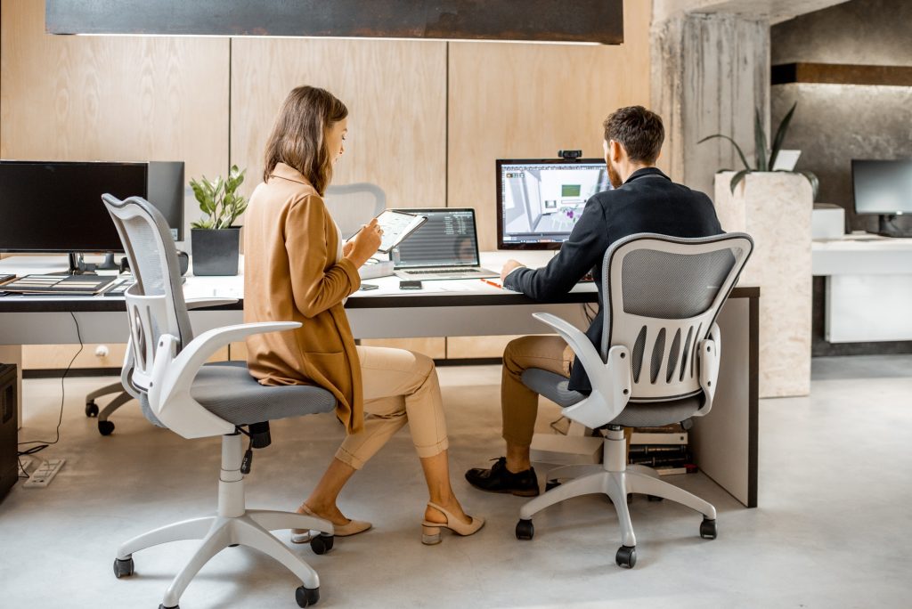Two interior designers working in the office